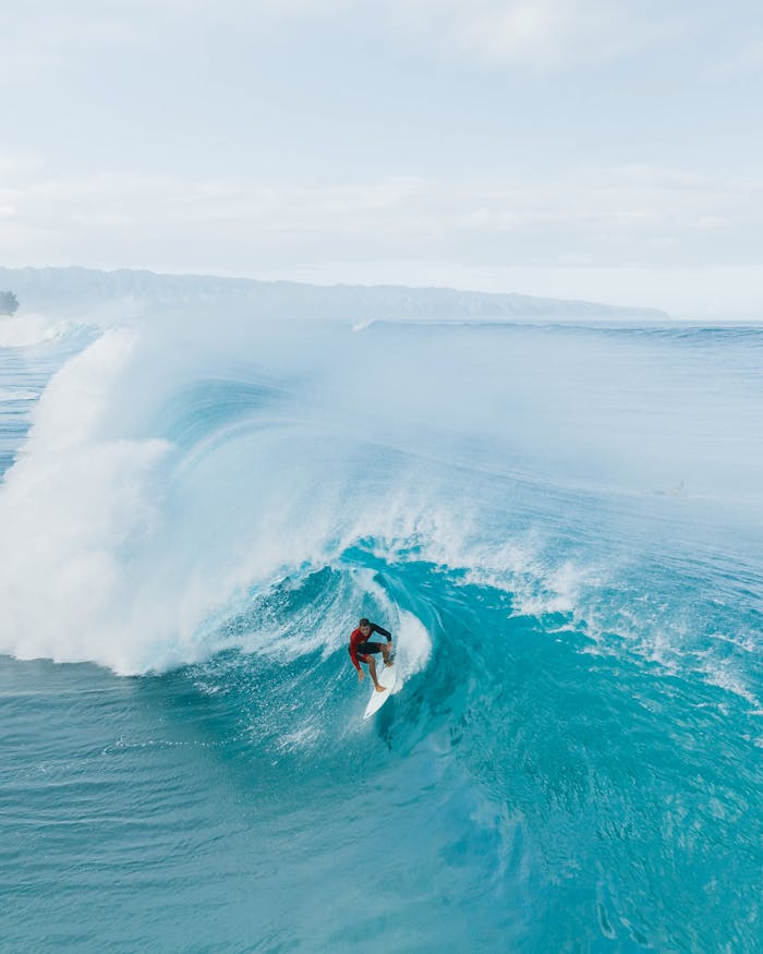 Person Surfing on Sea Waves